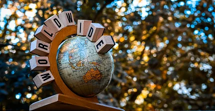 Globe with surrounding letters spelling "worldwide"