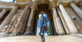The physical Voltaire Prize in front of the colonnade at the New Palace.