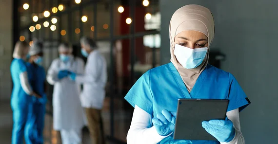 Doctor with tablet in hospital.