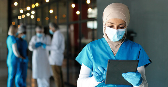 Doctor with tablet in hospital.