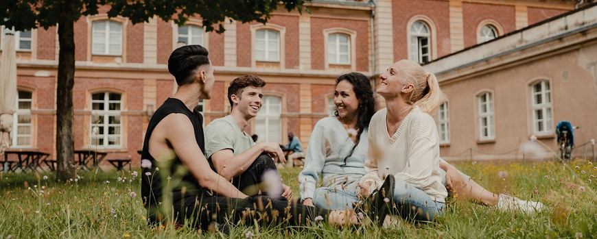 UP students sitting in grass
