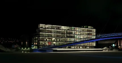 University building and bridge in the night